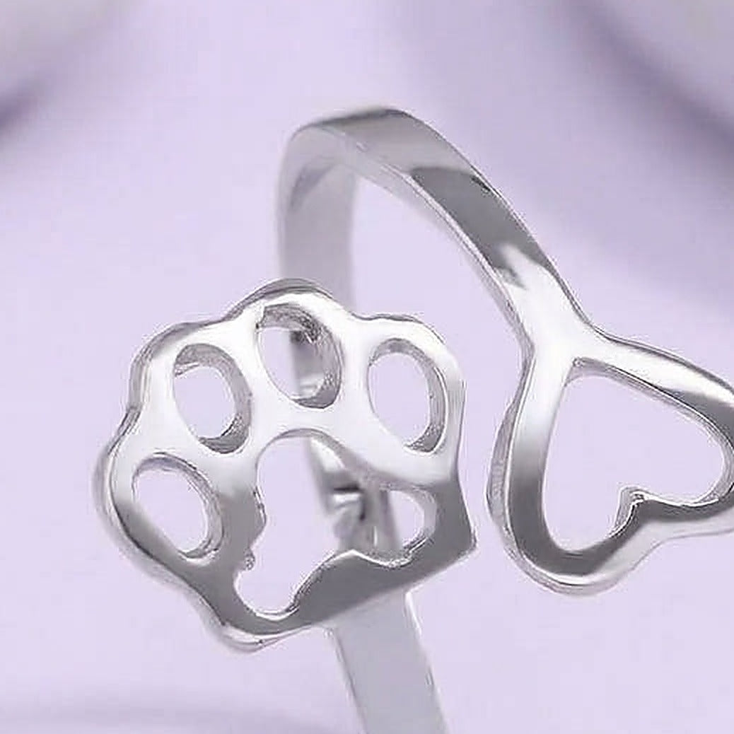 The Paw Prints Heart Ring - Close-up: silver ring paw and heart